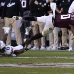 
              Texas A&M wide receiver Ainias Smith (0) is tripped up by Auburn safety Ladarius Tennison (13) during the second half of an NCAA college football game Saturday, Nov. 6, 2021, in College Station, Texas. Texas A&M won 20-3. (AP Photo/David J. Phillip)
            