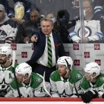 
              Dallas Stars head coach Rick Bowness instructs his players during the second period of an NHL hockey game against the Winnipeg Jets, Tuesday, Nov. 2, 2021 in Winnipeg, Manitoba. (Fred Greenslade/The Canadian Press via AP)
            