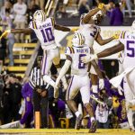 
              LSU wide receiver Jaray Jenkins (10) and running back Tyrion Davis-Price (3) celebrate after a touchdown against Texas A&M during the fourth quarter of an NCAA college football game in Baton Rouge, La., Saturday, Nov. 27, 2021. (AP Photo/Derick Hingle)
            