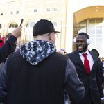 
              Nebraska safety Marquel Dismuke, right, pauses to greet, fan Charlie Colón, of Lincoln during the team's Unity Walk before playing against Ohio State in an NCAA college football game Saturday, Nov. 6, 2021, at Memorial Stadium in Lincoln, Neb. (AP Photo/Rebecca S. Gratz)
            