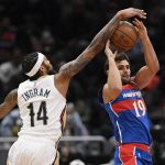 
              New Orleans Pelicans forward Brandon Ingram (14) defends against Washington Wizards guard Raul Neto (19) during the first half of an NBA basketball game Monday, Nov. 15, 2021, in Washington. (AP Photo/Nick Wass)
            