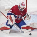
              Montreal Canadiens goaltender Sam Montembeault makes a save against the Nashville Predators during second-period NHL hockey game action in Montreal, Saturday, Nov. 20, 2021. (Graham Hughes/The Canadian Press via AP)
            