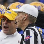 
              Pittsburgh head coach Pat Narduzzi, left, talks with referee Jeff Heaser after the Pitt defense appeared down Miami running back Jaylan Knighton (4) for a safety in the second half of an NCAA college football game, Saturday, Oct. 30, 2021, in Pittsburgh. The officials ruled that Knighton made it out of the end zone, nullifying a safety. Miami won 38-34. (AP Photo/Keith Srakocic)
            