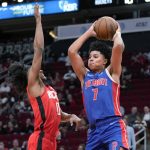 
              Detroit Pistons guard Killian Hayes (7) passes the ball as Houston Rockets guard Jalen Green defends during the first half of an NBA basketball game Wednesday, Nov. 10, 2021, in Houston. (AP Photo/Eric Christian Smith)
            