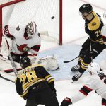 
              Boston Bruins' Derek Forbort scores on Ottawa Senators goaltender Matt Murray during the second period of an NHL hockey game Tuesday, Nov. 9, 2021, in Boston. (AP Photo/Winslow Townson)
            