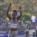 
              Peres Jepchirchir of Kenya reacts after crossing the finish line first in the women's division of the New York City Marathon in New York, Sunday, Nov. 7, 2021. (AP Photo/Seth Wenig)
            