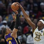 
              Indiana Pacers' Myles Turner (33) blocks the shot of Los Angeles Lakers' Russell Westbrook (0) during the second half of an NBA basketball game Wednesday, Nov. 24, 2021, in Indianapolis. (AP Photo/Darron Cummings)
            