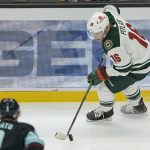 
              Minnesota Wild center Rem Pitlick (16) skates against the Seattle Kraken during the second period of an NHL hockey game, Saturday, Nov. 13, 2021, in Seattle. (AP Photo/Ted S. Warren)
            