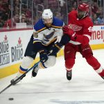
              St. Louis Blues defenseman Colton Parayko (55) protects the puck from Detroit Red Wings right wing Givani Smith (48) in the second period of an NHL hockey game Wednesday, Nov. 24, 2021, in Detroit. (AP Photo/Paul Sancya)
            