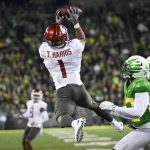 
              Washington State wide receiver Travell Harris (1) hauls in a pass over Oregon safety Verone McKinley III (23) during the second quarter of an NCAA college football game Saturday, Nov. 13, 2021, in Eugene, Ore. (AP Photo/Andy Nelson)
            