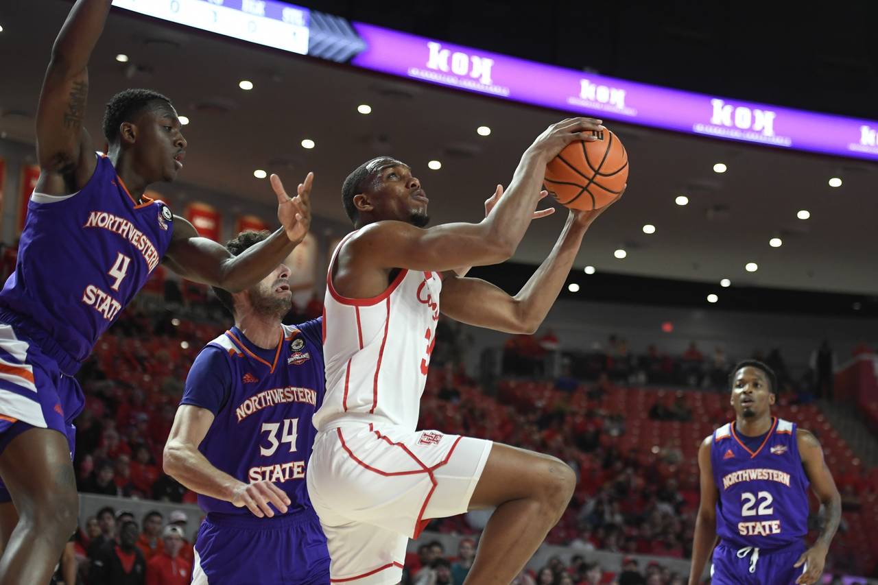 Houston forward Fabian White Jr. shoots in front of Northwestern State center Kendal Coleman (4) an...