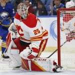 
              Calgary Flames goaltender Jacob Markstrom (25) watches the puck go wide during the first period of an NHL hockey game against the Buffalo Sabres, Thursday, Nov. 18, 2021, in Buffalo, N.Y. (AP Photo/Jeffrey T. Barnes)
            