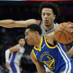 
              Golden State Warriors guard Jordan Poole (3) drives by Detroit Pistons guard Cade Cunningham during the second half of an NBA basketball game, Friday, Nov. 19, 2021, in Detroit. (AP Photo/Carlos Osorio)
            