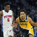
              Indiana Pacers guard Malcolm Brogdon (7) drives as Detroit Pistons guard Hamidou Diallo (6) defends during the second half of an NBA basketball game, Wednesday, Nov. 17, 2021, in Detroit. (AP Photo/Carlos Osorio)
            