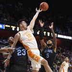 
              Tennessee's John Fulkerson (10) tangles with Villanova's Jermaine Samuels (23) while reaching for a rebound with Villanova's Justin Moore (5) in the first half of an NCAA college basketball game, Saturday, Nov. 20, 2021, in Uncasville, Conn. (AP Photo/Jessica Hill)
            