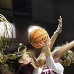 
              South Dakota's Chloe Lamb, right, is prevented from making a basket by South Carolina's Victoria Saxton during NCAA college basketball game, Friday, Nov. 12, 2021, at the Sanford Pentagon in Sioux Falls, S.D. (Erin Woodiel/The Argus Leader via AP)
            
