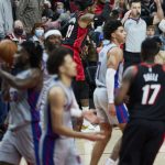 
              Portland Trail Blazers forward Robert Covington, rear, reacts after making a 3-point basket against the Detroit Pistons during the second half of an NBA basketball game in Portland, Ore., Tuesday, Nov. 30, 2021. (AP Photo/Craig Mitchelldyer)
            