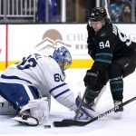 
              Toronto Maple Leafs goaltender Joseph Woll (60) stops a shot by San Jose Sharks left wing Alexander Barabanov (94) during the first period of an NHL hockey game Friday, Nov. 26, 2021, in San Jose, Calif. (AP Photo/Tony Avelar)
            