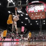 
              Stanford forward Maxime Raynaud (42) dunks against Valparaiso guard Sheldon Edwards (13) during the first half of an NCAA college basketball game in Stanford, Calif., on Wednesday, Nov. 17, 2021. (AP Photo/Tony Avelar)
            