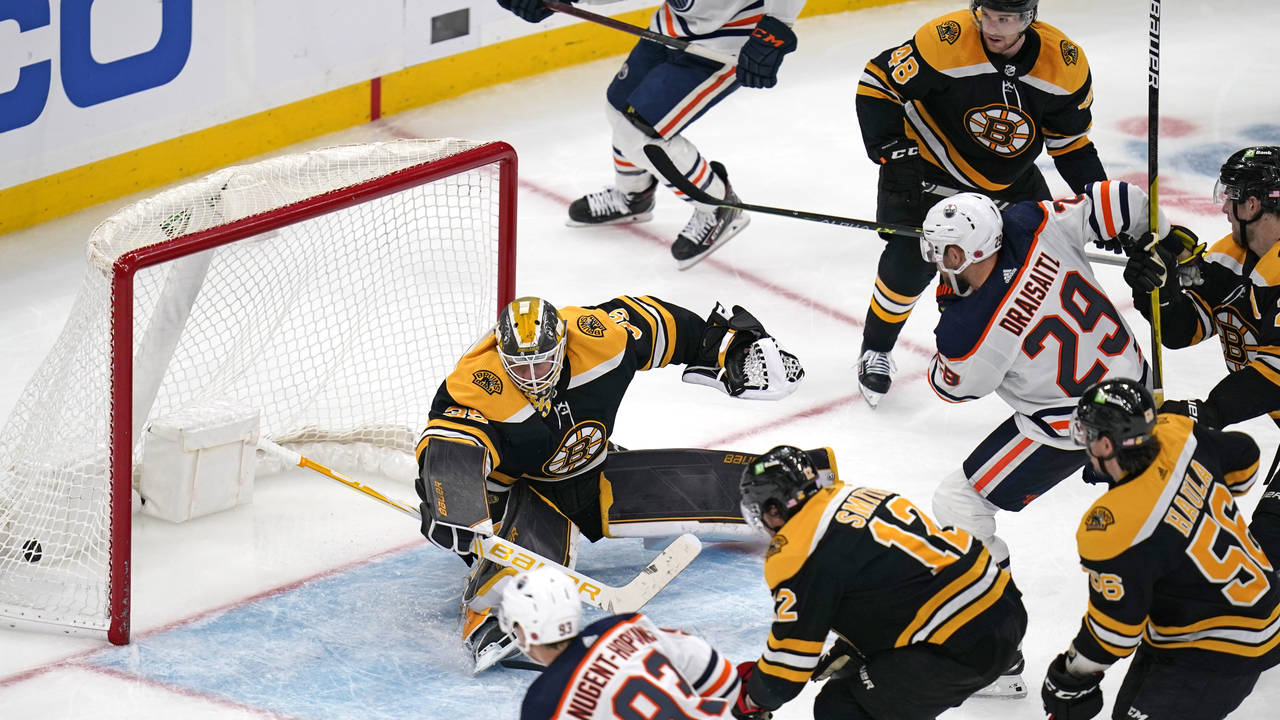 Edmonton Oilers center Leon Draisaitl (29) shoots the puck past Boston Bruins goaltender Linus Ullm...
