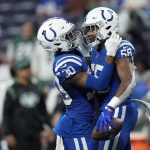 
              Indianapolis Colts' Bobby Okereke (58) celebrates his interception with George Odum (30) during the second half of an NFL football game against the New York Jets, Thursday, Nov. 4, 2021, in Indianapolis. (AP Photo/AJ Mast)
            