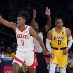 
              Houston Rockets guard Jalen Green, left, gestures after a making a three-point basket next to Los Angeles Lakers guard Russell Westbrook during the first half of an NBA basketball game Tuesday, Nov. 2, 2021, in Los Angeles. (AP Photo/Marcio Jose Sanchez)
            