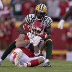 
              Kansas City Chiefs tight end Travis Kelce (87) catches a pass as Green Bay Packers cornerback Chandon Sullivan (39) defends during the first half of an NFL football game Sunday, Nov. 7, 2021, in Kansas City, Mo. (AP Photo/Charlie Riedel)
            