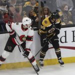 
              Ottawa Senators' Zach Sanford (13) and Boston Bruins' David Pastrnak look for the puck during the second period of an NHL hockey game Tuesday, Nov. 9, 2021, in Boston. (AP Photo/Winslow Townson)
            