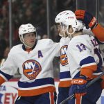 
              New York Islanders' Mathew Barzal (13) celebrates with teammates after scoring a goal against the Minnesota Wild during the second period of an NHL hockey game Sunday, Nov. 7, 2021, in St. Paul, Minn. (AP Photo/Stacy Bengs)
            