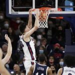 
              Gonzaga center Chet Holmgren, center, dunks during the first half of an NCAA college basketball game against Dixie State, Tuesday, Nov. 9, 2021, in Spokane, Wash. (AP Photo/Young Kwak)
            
