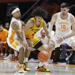 
              East Tennessee State guard Jordan King (2) has the ball knocked away by Tennessee guard Zakai Zeigler (5) as forward John Fulkerson (10) defends during an NCAA college basketball game, Sunday, Nov. 14, 2021, in Knoxville, Tenn. (AP Photo/Wade Payne)
            
