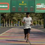 
              A man runs in front of a  Formula One countdown clock on the corniche walkway in Jiddah, Saudi Arabia, Sunday, Nov. 21, 2021. The Formula One race takes place from Dec. 3-5 along the Red Sea city of Jiddah's coast, marking the first time the premier sporting event is held in Saudi Arabia. (AP Photo/Amr Nabil)
            