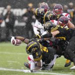 
              Hamilton Tiger-Cats running back Don Jackson (5) lunges across the goal line as he scores a touchdown during first half CFL division semi-final football action against the Montreal Alouettes in Hamilton, Ontario, Sunday, Nov. 28, 2021. (Nathan Denette/The Canadian Press via AP)
            