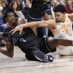 
              Villanova's Brandon Slater (3) looks to pass under pressure from Tennessee's Olivier Nkamhoua (13) in the first half of an NCAA college basketball game, Saturday, Nov. 20, 2021, in Uncasville, Conn. (AP Photo/Jessica Hill)
            