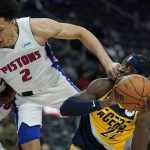 
              Detroit Pistons guard Cade Cunningham (2) fouls Indiana Pacers guard Caris LeVert (22) during the second half of an NBA basketball game, Wednesday, Nov. 17, 2021, in Detroit. (AP Photo/Carlos Osorio)
            