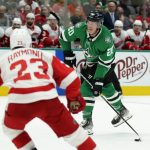 
              Detroit Red Wings right wing Lucas Raymond (23) looks on as Dallas Stars defenseman Ryan Suter (20) takes a shot and scores on the play in the first period of an NHL hockey game in Dallas, Tuesday, Nov. 16, 2021. (AP Photo/Tony Gutierrez)
            