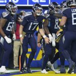 
              Tennessee Titans quarterback Ryan Tannehill, center, reacts after scoring a touchdown during the first half of an NFL football game against the Los Angeles Rams, Sunday, Nov. 7, 2021, in Inglewood, Calif. (AP Photo/Ashley Landis)
            