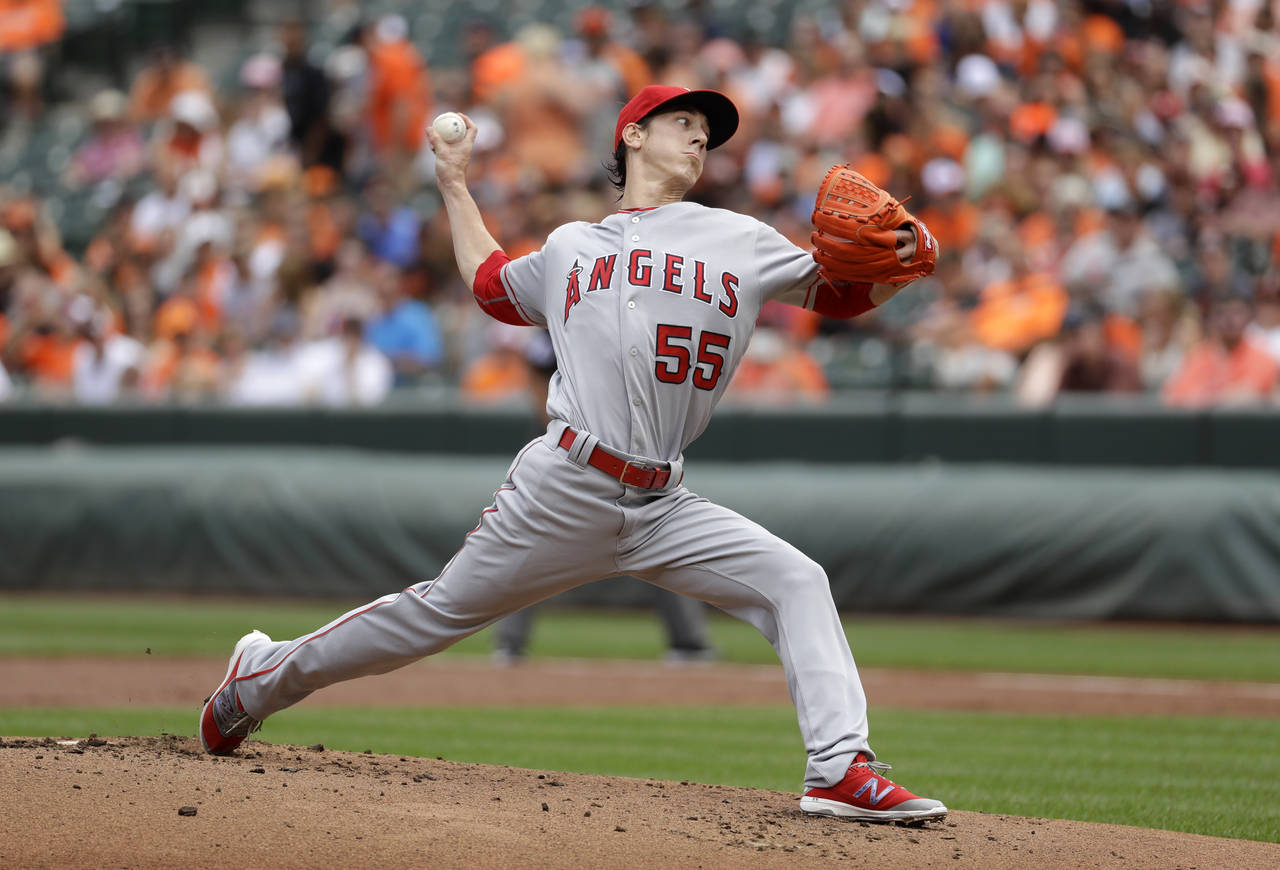 FILE - Los Angeles Angels starting pitcher Tim Lincecum throws to the Baltimore Orioles during a ba...