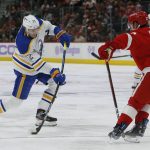 
              Buffalo Sabres right wing Tage Thompson (72) takes a shot on goal against Detroit Red Wings right wing Carter Rowney (37) during the second period of an NHL hockey game Saturday, Nov. 27, 2021, in Detroit. (AP Photo/Duane Burleson)
            