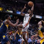 
              New Orleans Pelicans forward Herbert Jones (5) shoots over Indiana Pacers center Myles Turner (33) during the second half of an NBA basketball game in Indianapolis, Saturday, Nov. 20, 2021. The Pacers defeated the Pelicans 111-94. (AP Photo/Michael Conroy)
            