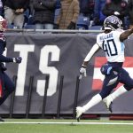 
              Tennessee Titans running back Dontrell Hilliard, right, raises the football after beating New England Patriots safety Kyle Dugger (23) on his 68-yard touchdown run during the first half of an NFL football game, Sunday, Nov. 28, 2021, in Foxborough, Mass. (AP Photo/Mary Schwalm)
            