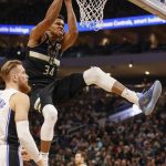 
              Milwaukee Bucks forward Giannis Antetokounmpo (34) reacts after a dunk against the Orlando Magic during the first half of an NBA basketball game Saturday, Nov. 20, 2021, in Milwaukee. (AP Photo/Jeffrey Phelps)
            