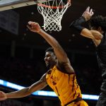 
              Iowa State guard Izaiah Brockington (1) fights for a rebound with Alabama State forward Trace Young (0) during the second half of an NCAA college basketball game, Tuesday, Nov. 16, 2021, in Ames, Iowa. (AP Photo/Charlie Neibergall)
            