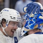 
              Toronto Maple Leafs center Auston Matthews (34) and goaltender Jack Campbell (36) congratulate each other after the team's win over the Boston Bruins in an NHL hockey game Saturday, Nov. 6, 2021, in Toronto. (Frank Gunn/The Canadian Press via AP)
            