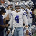 
              Dallas Cowboys quarterback Dak Prescott (4) stands on the sideline watching play against the Denver Broncos in the second half of an NFL football game in Arlington, Texas, Sunday, Nov. 7, 2021. (AP Photo/Ron Jenkins)
            