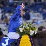 
              William Buick celebrates after riding Space Blues to victory during the Breeders' Cup Mile race at the Del Mar racetrack in Del Mar, Calif., Saturday, Nov. 6, 2021. (AP Photo/Jae C. Hong)
            