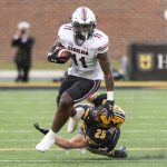 
              South Carolina running back ZaQuandre White, top, pushes past Missouri linebacker Blaze Alldredge, bottom, during the second quarter of an NCAA college football game Saturday, Nov. 13, 2021, in Columbia, Mo. (AP Photo/L.G. Patterson)
            