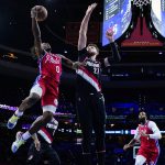 
              Philadelphia 76ers' Tyrese Maxey (0) goes up for a shot against Portland Trail Blazers' Jusuf Nurkic (27) during the first half of an NBA basketball game, Monday, Nov. 1, 2021, in Philadelphia. (AP Photo/Matt Slocum)
            