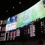 
              This Sept. 9, 2018 photo shows an odds board in a sports betting lounge at the Ocean Casino Resort in Atlantic City N.J,. for the first Sunday of pro football season. On Nov. 17, 2021, New jersey gambling regulators released figures showing that New Jersey's sports betting industry broke its own national record in October, taking in over $1.3 billion worth of sports bets for the month. (AP Photo/Wayne Parry)
            