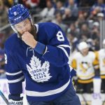 
              Toronto Maple Leafs' Jake Muzzin reacts after Pittsburgh Penguins' Jeff Carter scored during the first period of an NHL hockey game Saturday, Nov. 20, 2021, in Toronto. (Chris Young/The Canadian Press via AP)
            